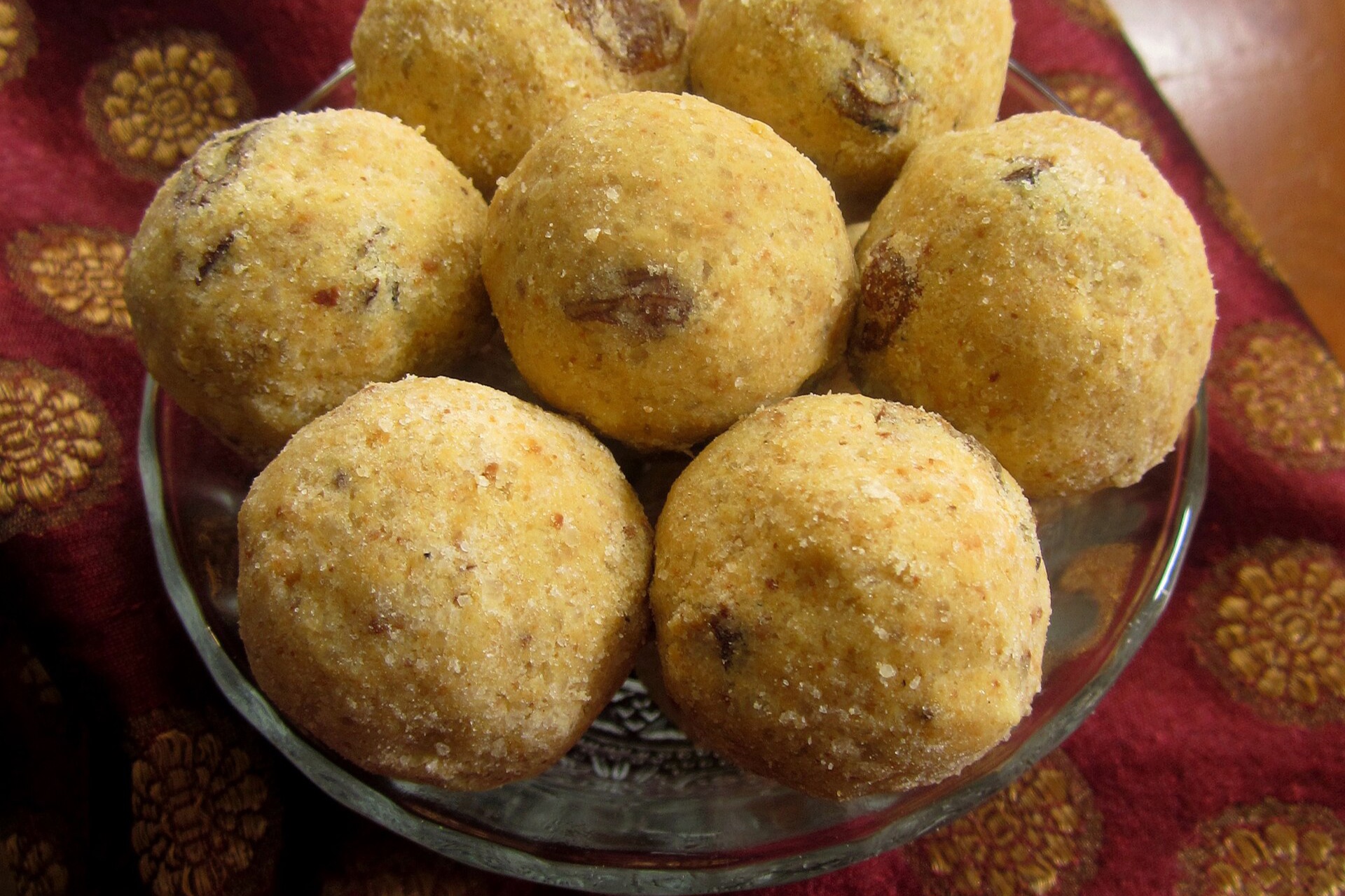 A bowl of golden besan laddoos, the prasad sold below Hanuman Garhi