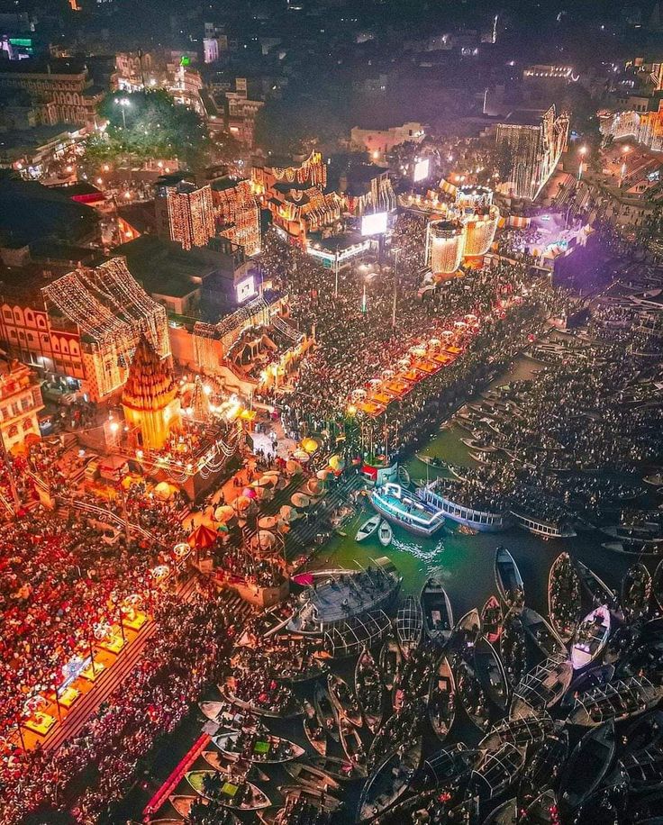 Dev Deepawali — earthen lamps in rows down the ghat steps at dusk, the river dark beyond