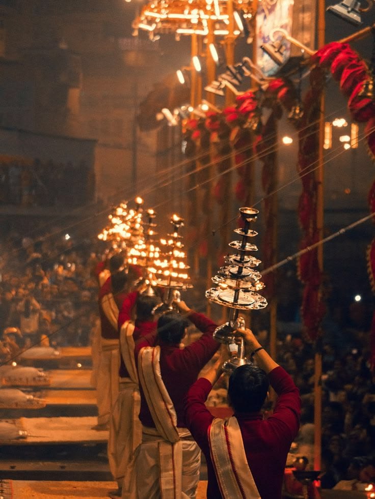 Ganga Mahotsav — a classical music performance on a lit stage above the ghat steps at night