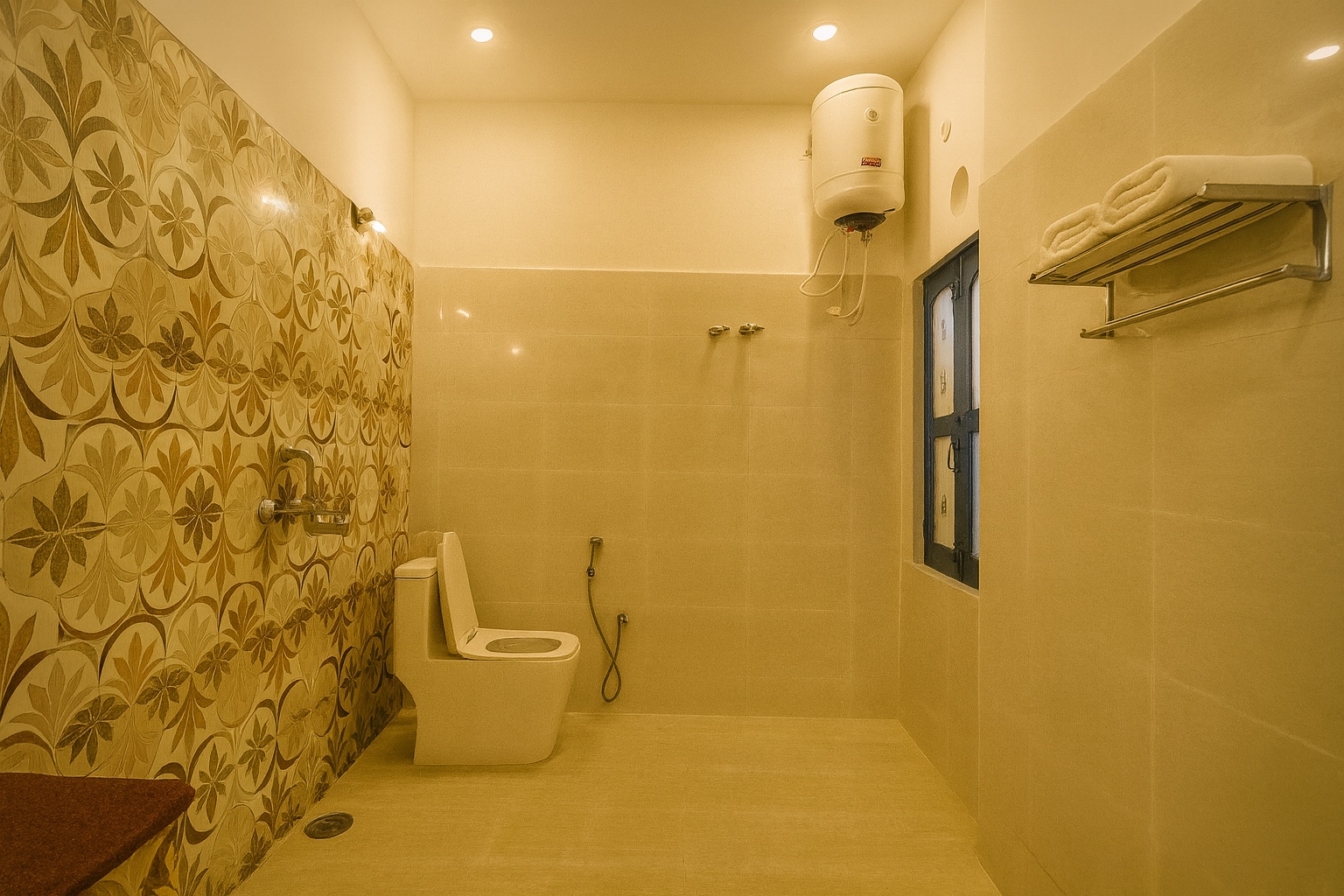 Boutique, Varanasi: bathroom with a patterned feature wall, wall-mounted water heater, western toilet with a health faucet and towels on a steel rack