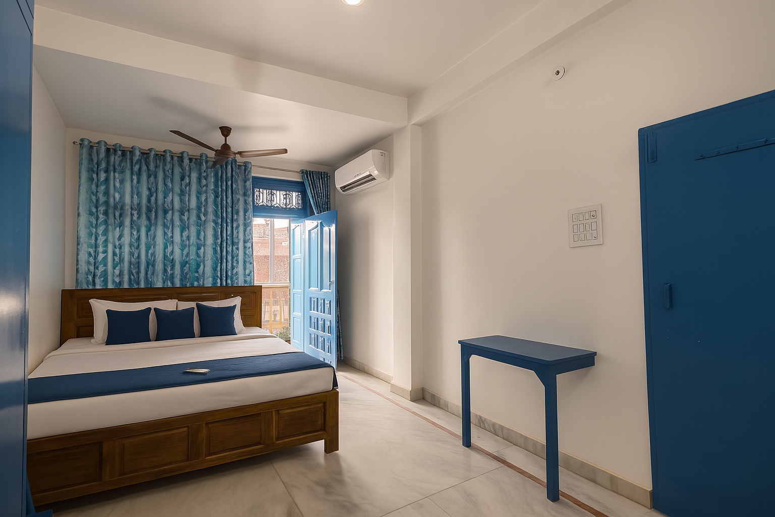 Santorini, Varanasi: white room with a teak bed, blue cushions and runner, blue shutters open to the balcony and a blue console table opposite